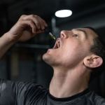 man taking CBD tincture