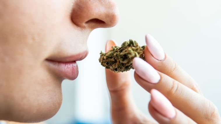 woman smelling weed