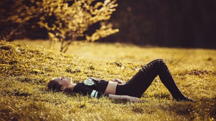 woman lying in nature